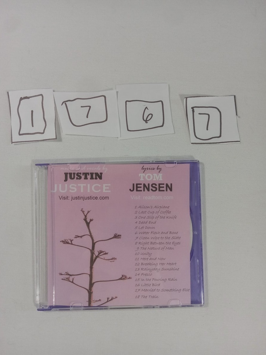 Item 1767 — JUSTIN JUSTICE 18 SONGS DISC PURPLE CASE, picture 1 of 2