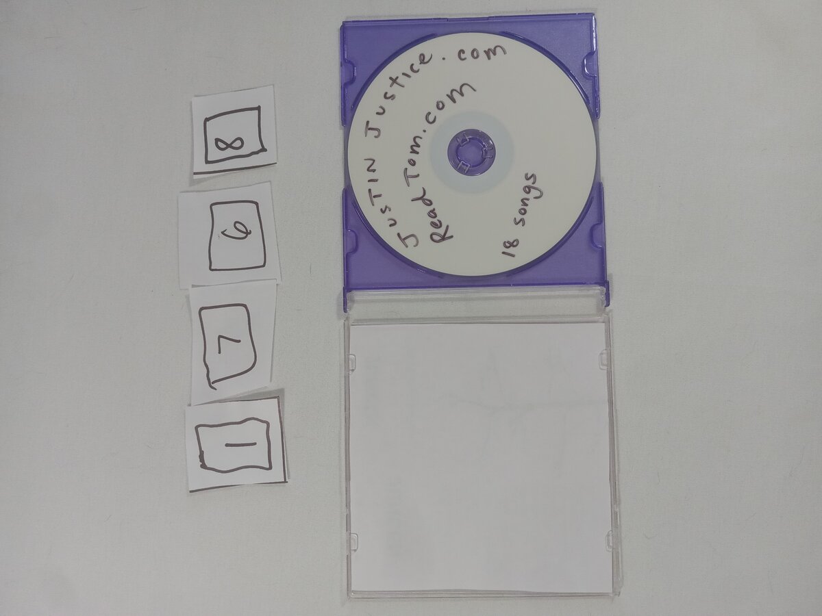 Item 1768 — JUSTIN JUSTICE 18 SONGS DISC, picture 2 of 2